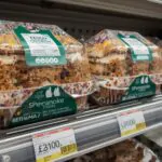 tesco birthday cake sandwich with colorful sprinkles and vanilla frosting displayed on supermarket shelf with price label